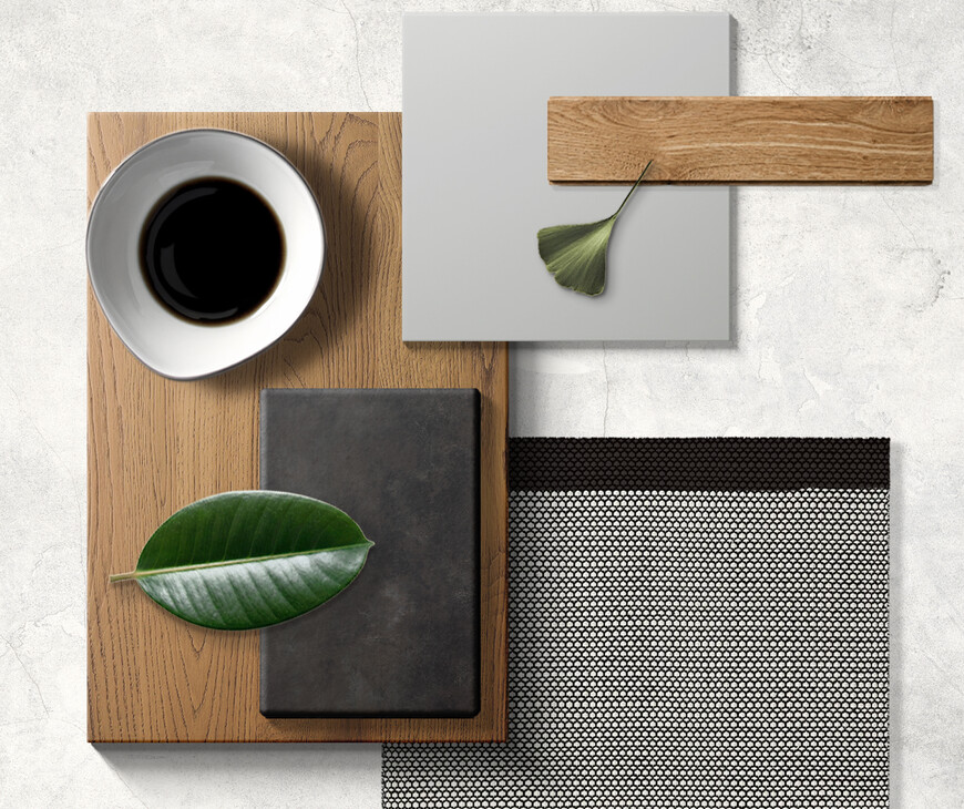 Per visualizzare la resa della futura cucina, sono stati accostati pezzi di Laminam Ossido Nero, laccato opaco piuma, impiallacciato travi rovere safari.