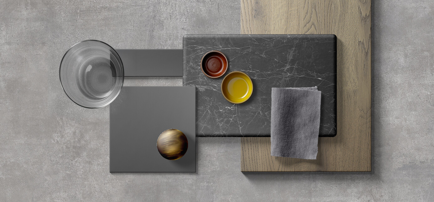 Idee per accostamenti cromatici con pezzi di Laminam Nero Greco, Fenix® nero Ingo e alluminio nero e pennellate di colori neutri e vivaci