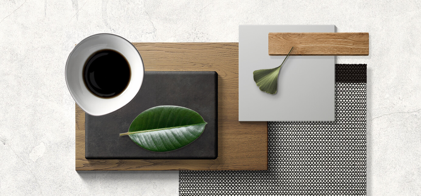 Per visualizzare la resa della futura cucina, sono stati accostati pezzi di Laminam Ossido Nero, laccato opaco piuma, impiallacciato travi rovere safari.